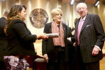 Las Vegas Mayor Carolyn Goodman, center, prepares to be sworn in to her third and final term du ...