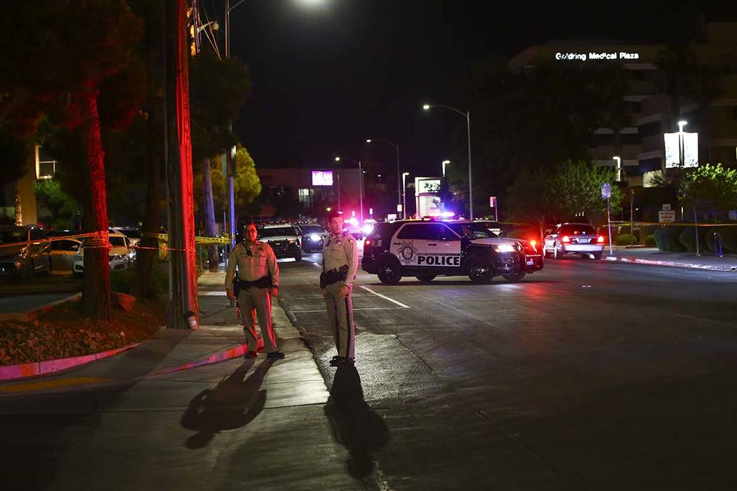 Las Vegas police gather outside of University Medical Center in Las Vegas on Saturday, July 20, ...