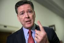 FILE - In this Dec. 17, 2018, file photo, former FBI Director James Comey speaks to reporters o ...