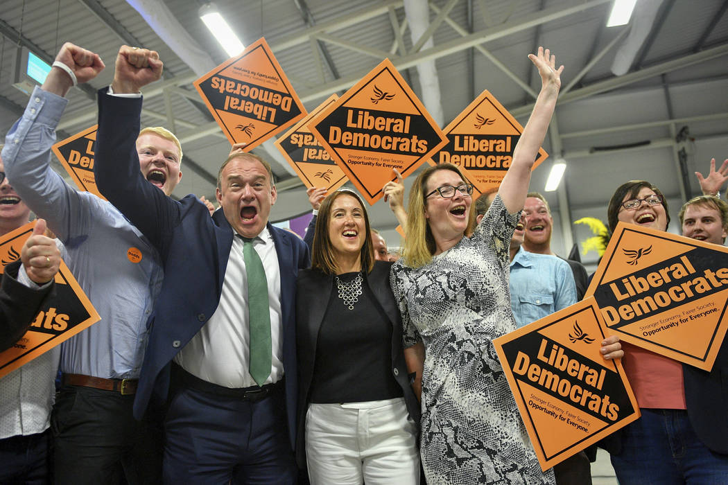 Liberal Democrats' Jane Dodds, centre, celebrates with supporters as she wins the seat in the B ...
