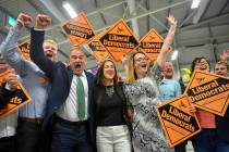 Liberal Democrats' Jane Dodds, centre, celebrates with supporters as she wins the seat in the B ...