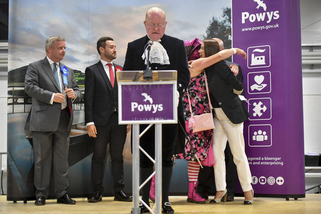 Liberal Democrats' Jane Dodds, right, receives a hug after hearing the result that she wins the ...