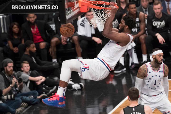 Philadelphia 76ers center Joel Embiid dunks during the second half of Game 4 of a first-round N ...