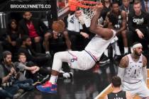 Philadelphia 76ers center Joel Embiid dunks during the second half of Game 4 of a first-round N ...