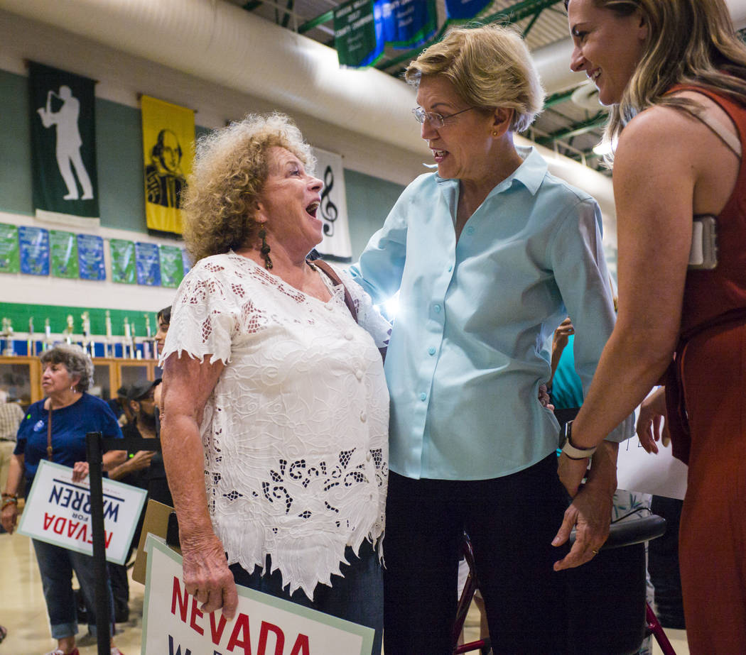 Sandi Athey, of Henderson, left, talks with Democratic presidential candidate Sen. Elizabeth Wa ...