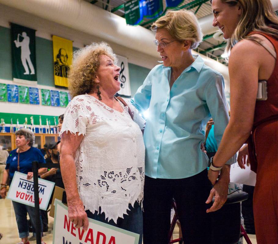 Sandi Athey, of Henderson, left, talks with Democratic presidential candidate Sen. Elizabeth Wa ...