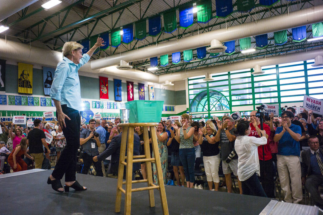 Democratic presidential candidate Sen. Elizabeth Warren, D-Mass., waves to supporters after spe ...