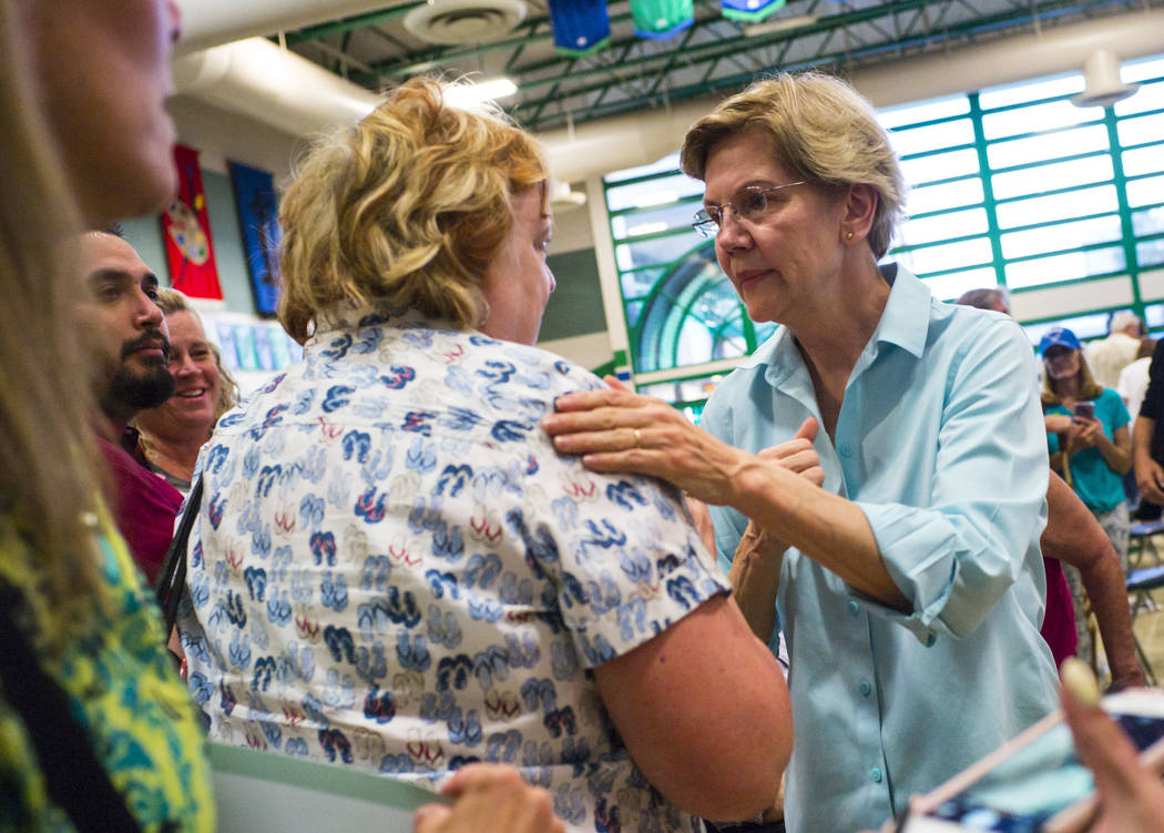 Democratic presidential candidate Sen. Elizabeth Warren, D-Mass., talks with supporters after s ...