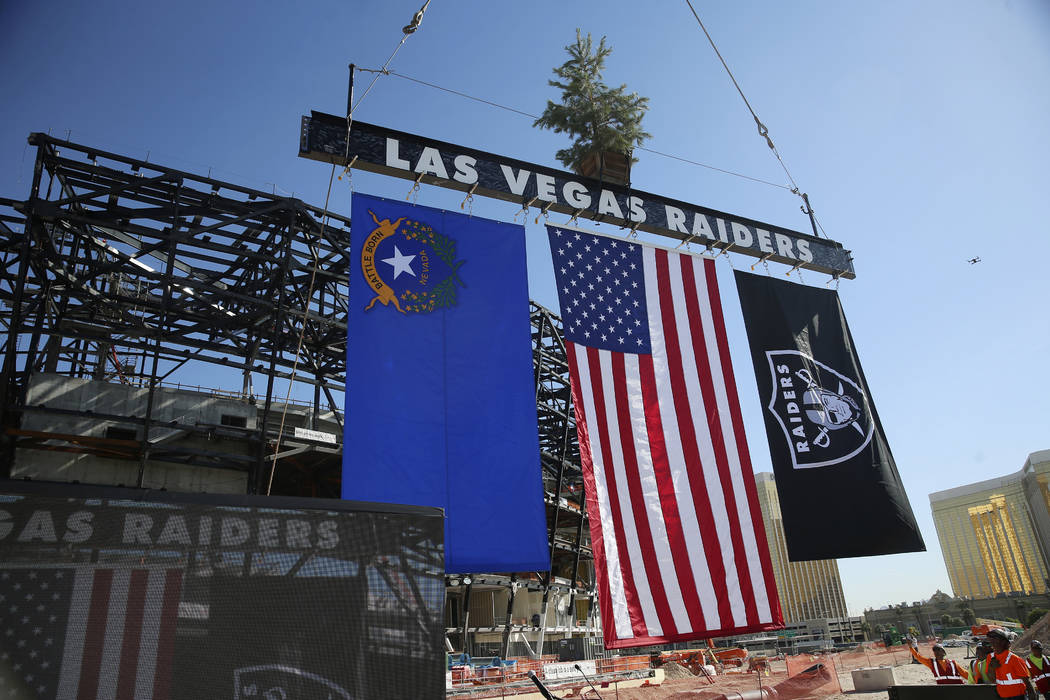 A steel beam is lifted during the Las Vegas Stadium Topping Out Ceremony in Las Vegas, Monday, ...
