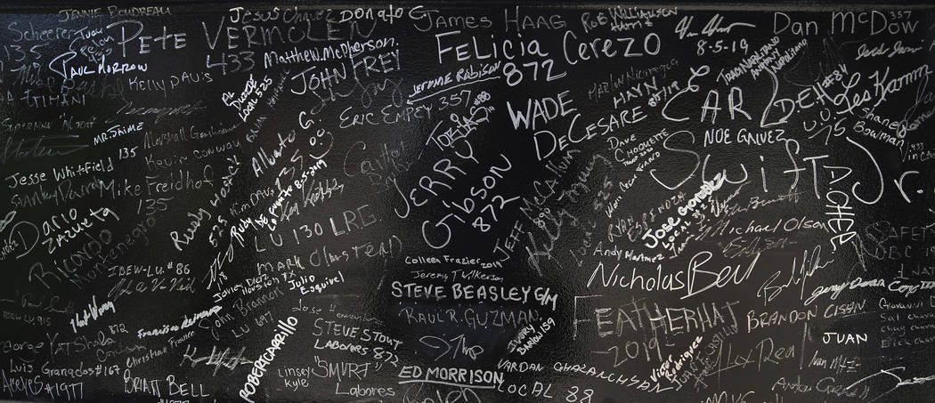 Signatures of workers and dignitaries on a steel beam during the Las Vegas Stadium Topping Out ...
