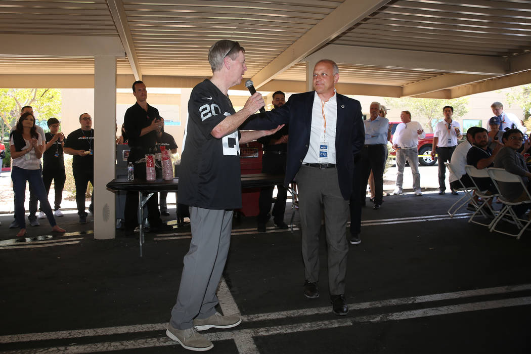 Allegiant Chairman and CEO Maury Gallagher, left, with Raiders president Marc Badain, during a ...