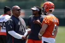 Cleveland Browns head coach Hue Jackson, left, talks with quarterback Baker Mayfield during NFL ...