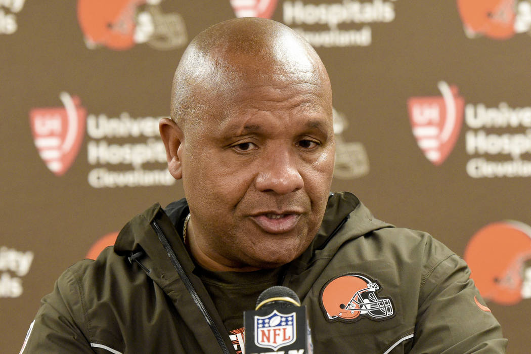 FILE - In this Sunday, Oct. 28, 2018, file photo, Cleveland Browns coach Hue Jackson meets with ...