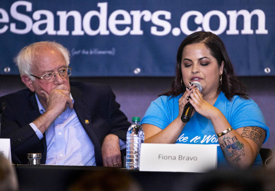 Democratic presidential candidate Sen. Bernie Sanders, I-Vt., left, listens to panel member Fio ...