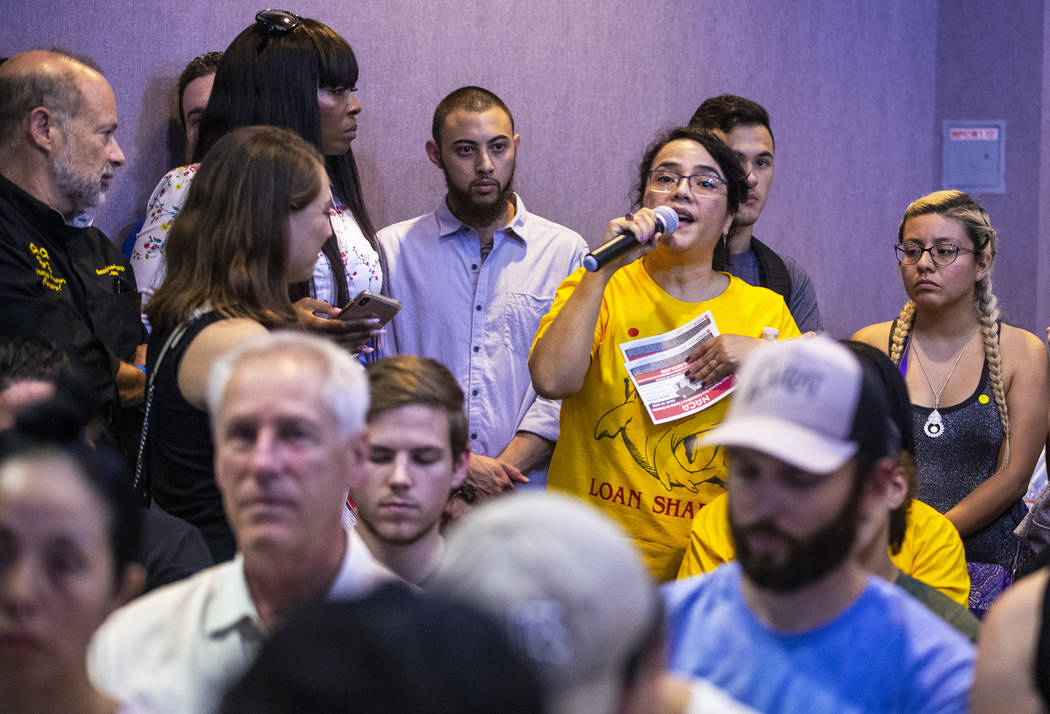 Laila Zechel, top/right, with the Neighborhood Assistance Corporation of America, asks a questi ...