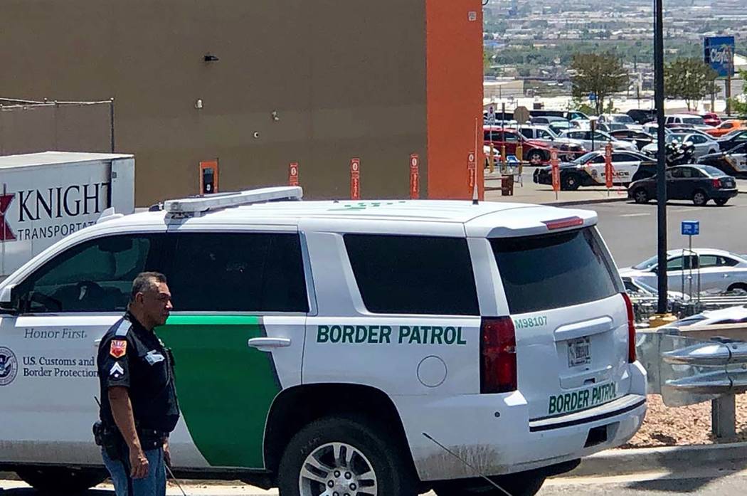 Law enforcement work the scene of a fatal shooting at a shopping mall in El Paso, Texas, on Sat ...