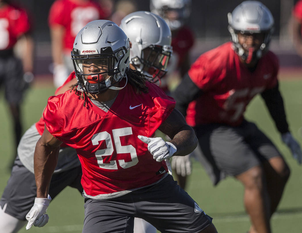 UNLV defensive end/linebacker Gabe McCoy (25) works through drills during the first day of trai ...