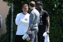 Oakland Raiders wide receiver Antonio Brown (84), right, meets with offensive coordinator Greg ...