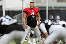 Oakland Raiders quarterback Derek Carr (4) stretches during the NFL team's training camp in Nap ...