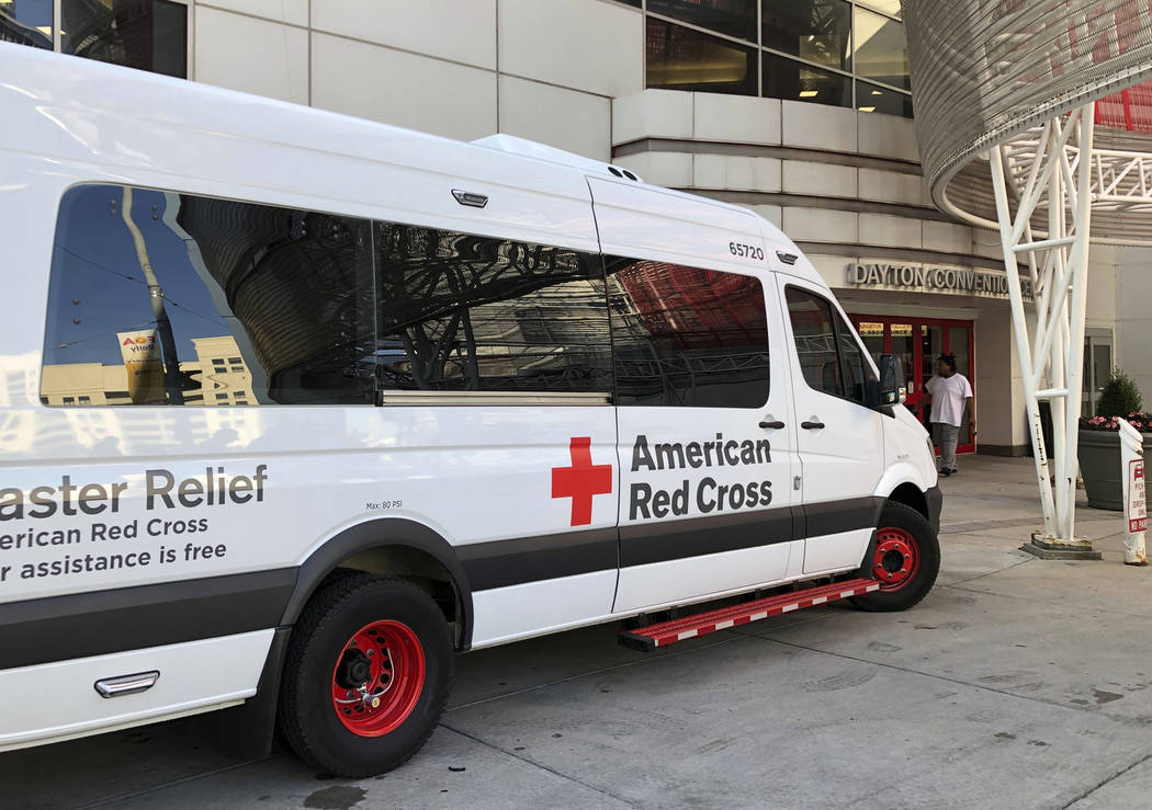 An American Red Cross disaster relief vehicle sits outside the Dayton Convention Center, where ...