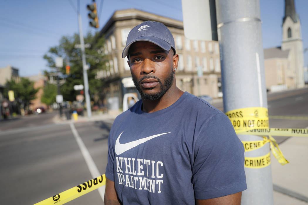Eyewitness Anthony Reynolds stands for a portrait at the scene of a mass shooting, Sunday, Aug. ...