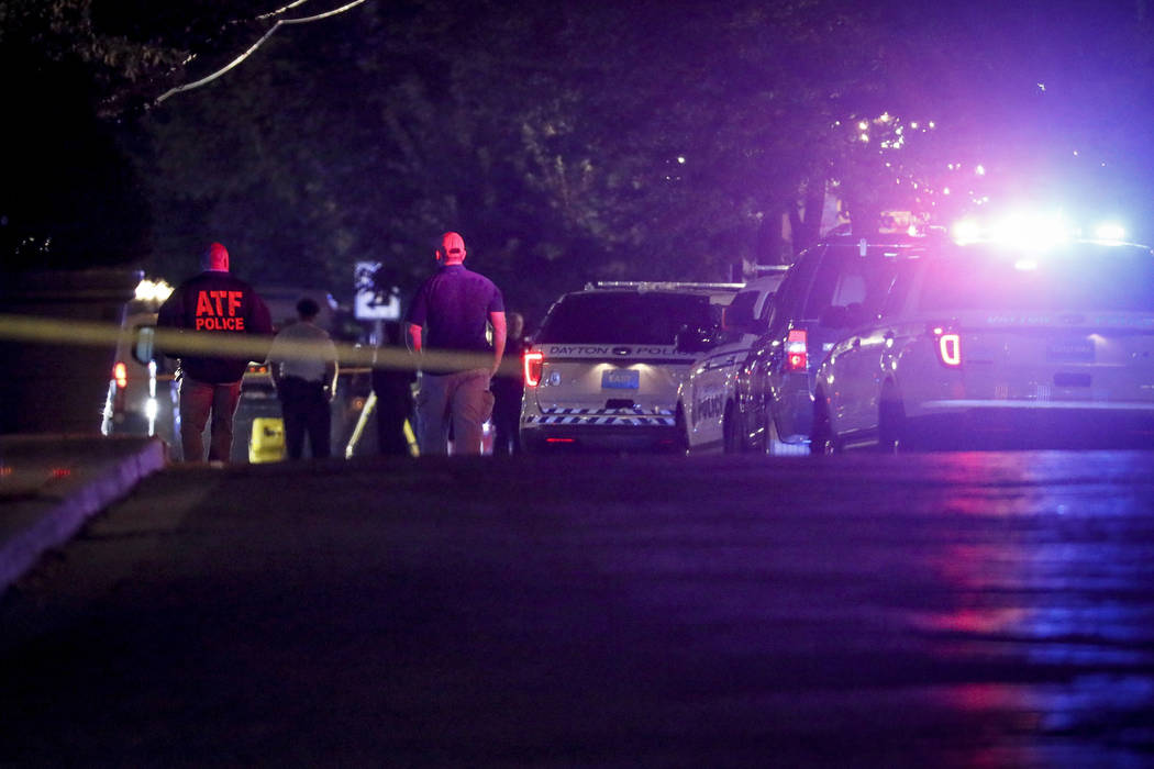 Authorities work at the scene of a mass shooting, Sunday, Aug. 4, 2019, in Dayton, Ohio. Severa ...
