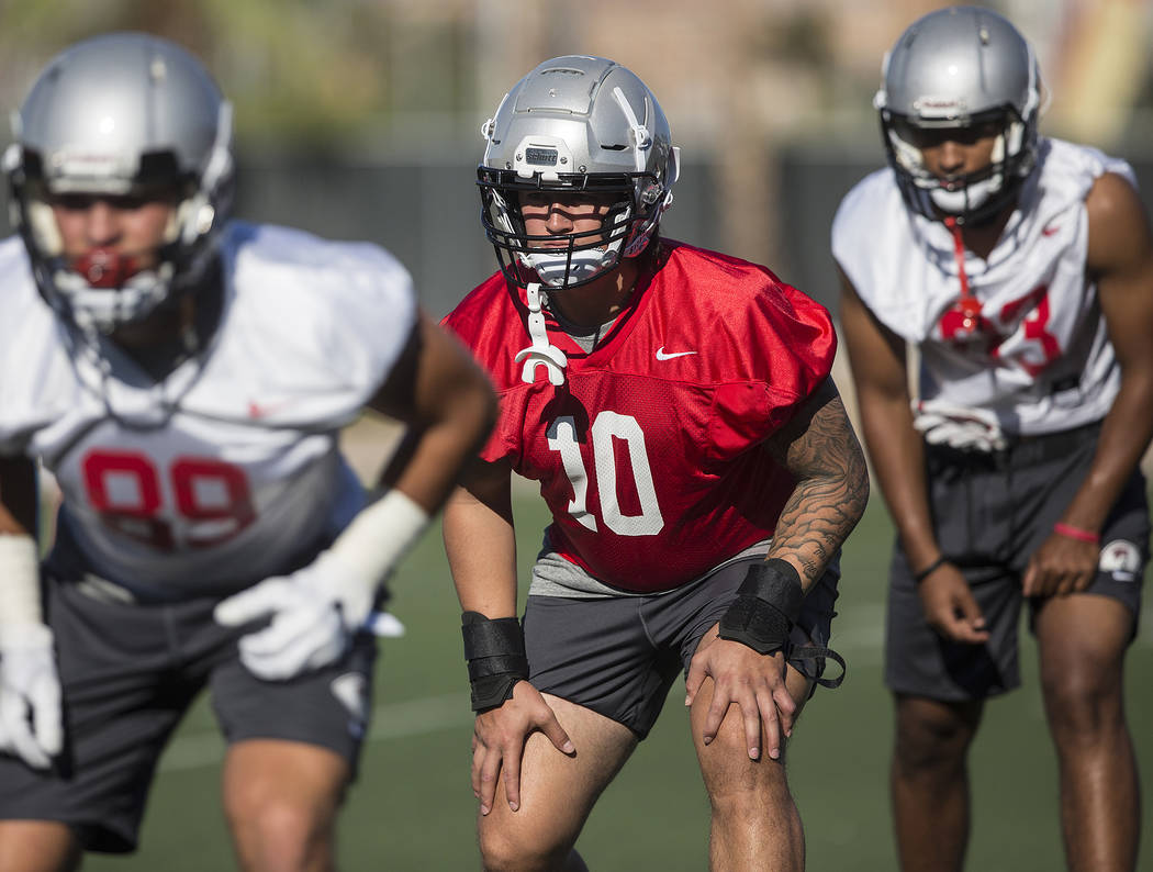 UNLV linebacker Vic Viramontes (10) works through drills during the first day of training camp ...
