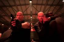 This image released by Universal Pictures shows Dwayne Johnson, left, and Jason Statham in a sc ...