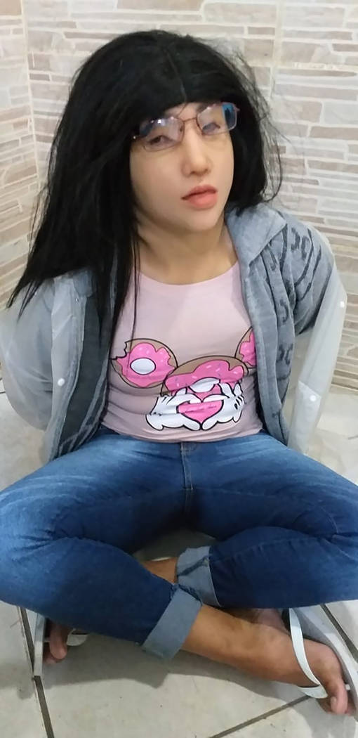 This photo released by the Rio de Janeiro Penitentiary Administration Secretariat, shows a man ...