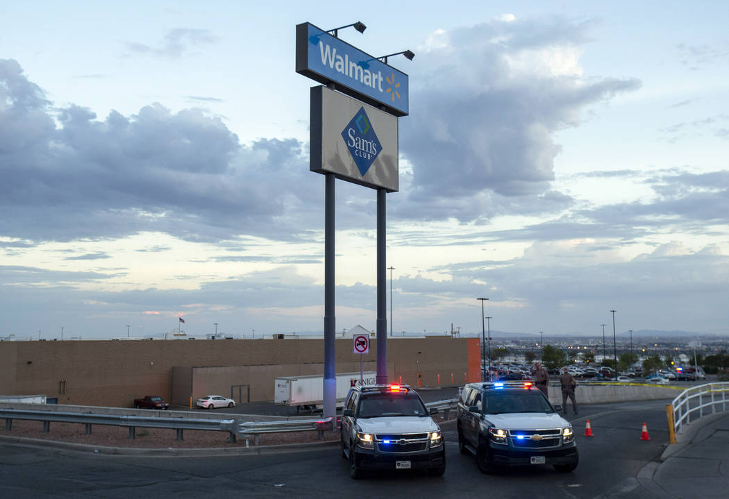 Texas state police cars block the access to the Walmart store in the aftermath of a mass shooti ...