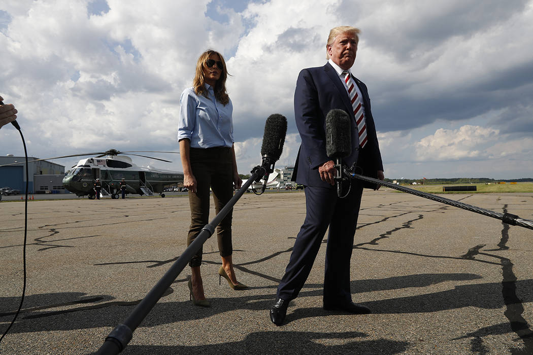 President Donald Trump, with first lady Melania Trump, walks to Air Force One after speaking to ...