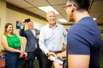 Democratic presidential candidate Washington Gov. Jay Inslee, second from right, greets attende ...