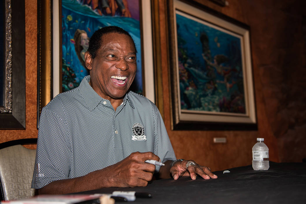 Cliff Branch, a former wide receiver for the Raiders, signs autographs at the Mermaid Lounge at ...