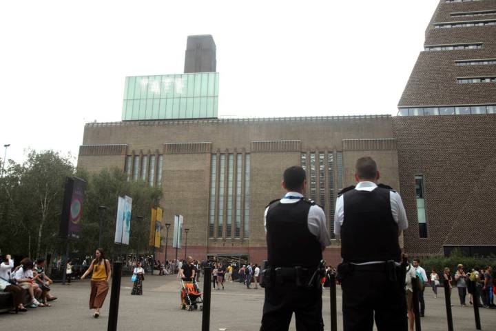 Emergency crews attending a scene at the Tate Modern art gallery, London, Sunday, Aug. 4, 2019. ...