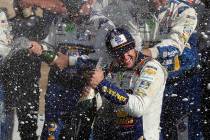 Chase Elliott celebrates his victory with his pit crew after winning a NASCAR Cup Series auto r ...