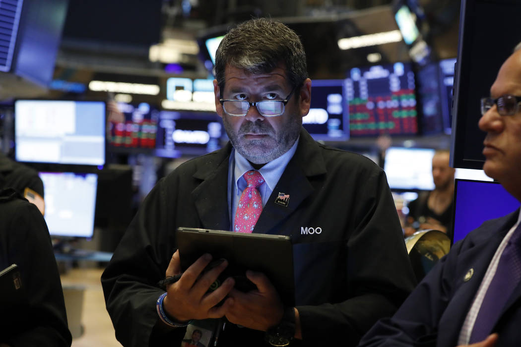 A trader works on the floor of the New York Stock Exchange, Monday, Aug. 5, 2019. (Richard Drew/AP)