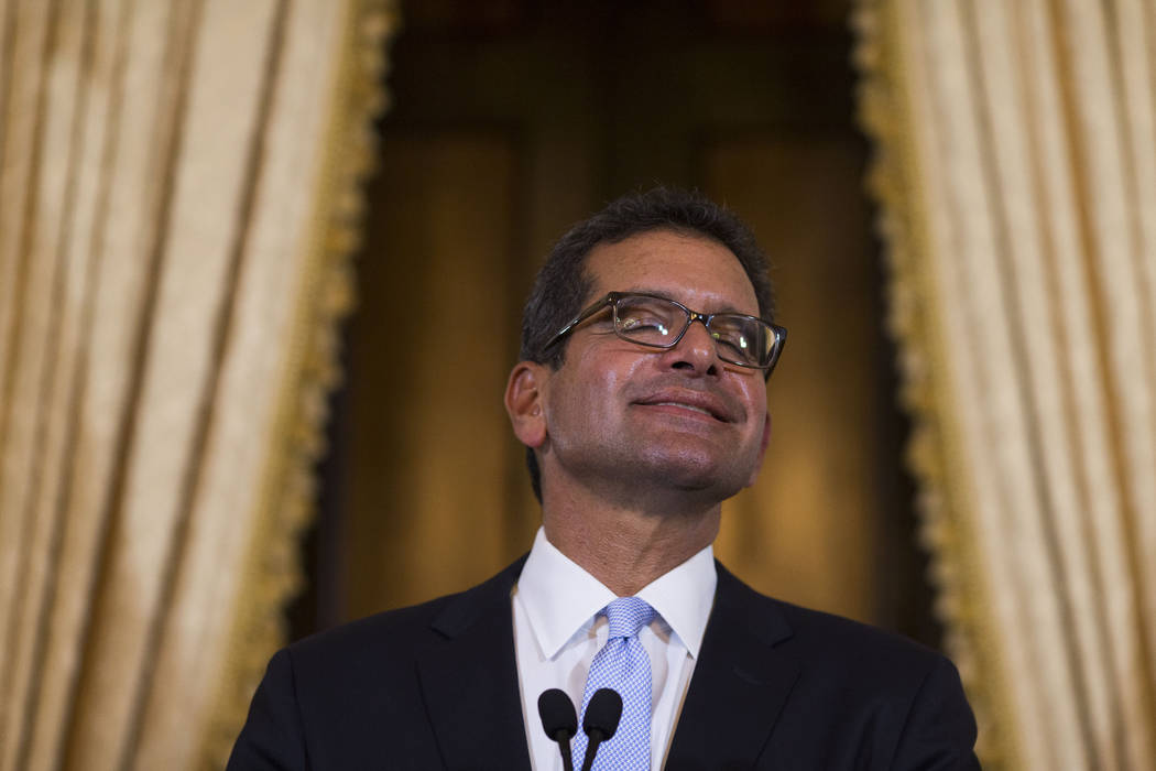 Pedro Pierluisi, sworn in as Puerto Rico's governor, smiles during a press conference in San Ju ...