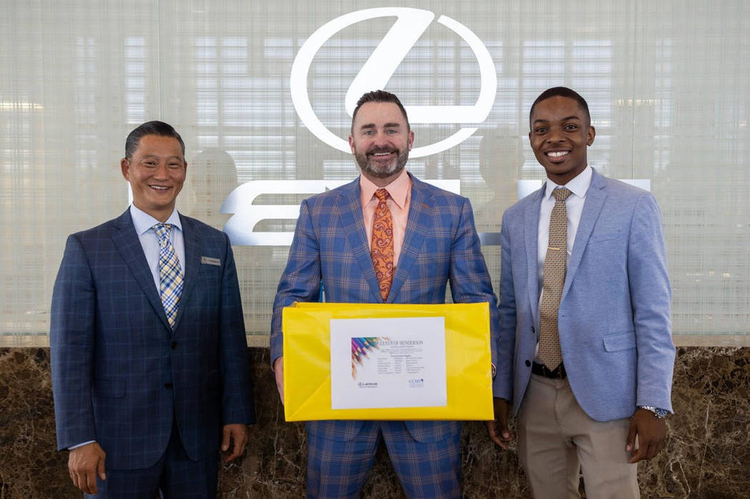 From left, certified sales and leasing consultant Tyron Shigemoto, General Manager Ryon Walters ...