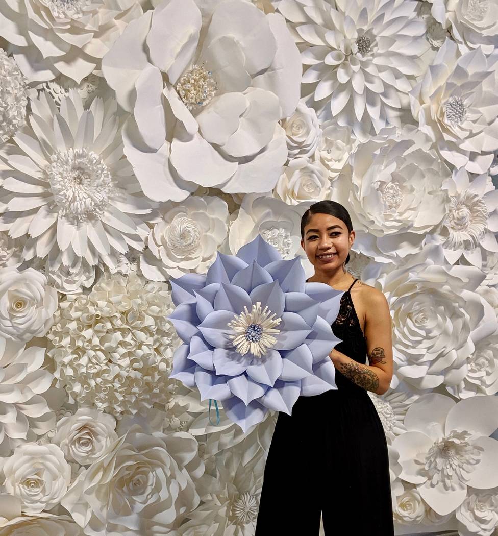 Paper Petals & Wine Daniella Chau poses with a paper flower she made at Paper Petals & Wine.