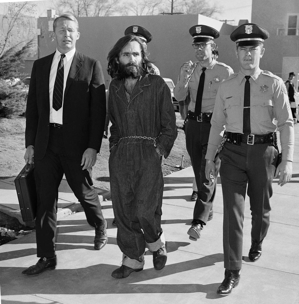 A Dec. 3, 1969, file photo shows Charles Manson en route to court in Independence, Calif., foll ...