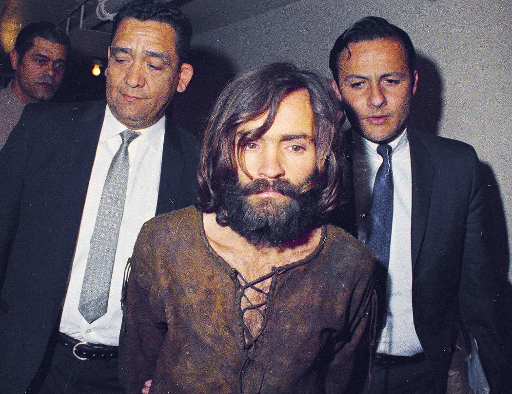 FILE - In this 1969 file photo, Charles Manson is escorted to his arraignment on conspiracy-mur ...