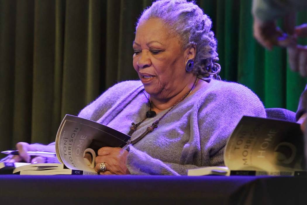 Author Toni Morrison signs copies of her latest book "Home," during Google's online program ser ...