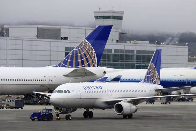 In this July 13, 2011 file photo, United Airlines planes sit on a tarmac. (AP Photo/Eric Risber ...