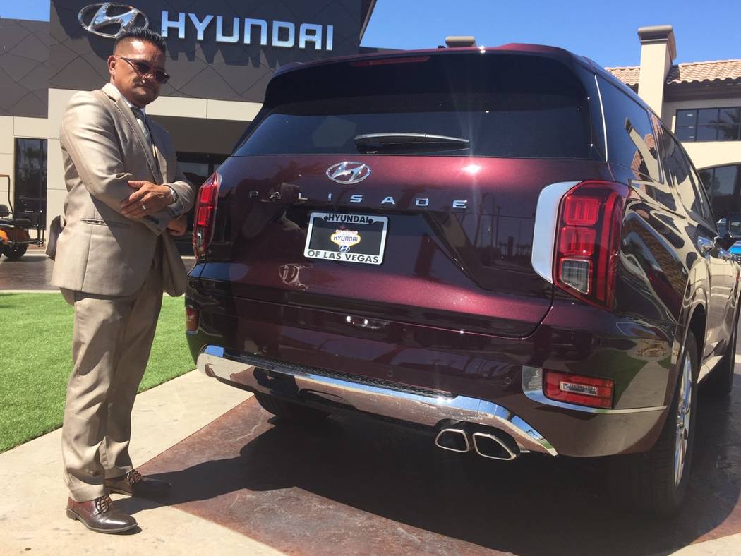 Hyundai of Las Vegas executive Eddie Matias is seen with the 2020 Hyundai Palisade sport utilit ...