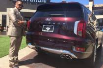 Hyundai of Las Vegas executive Eddie Matias is seen with the 2020 Hyundai Palisade sport utilit ...
