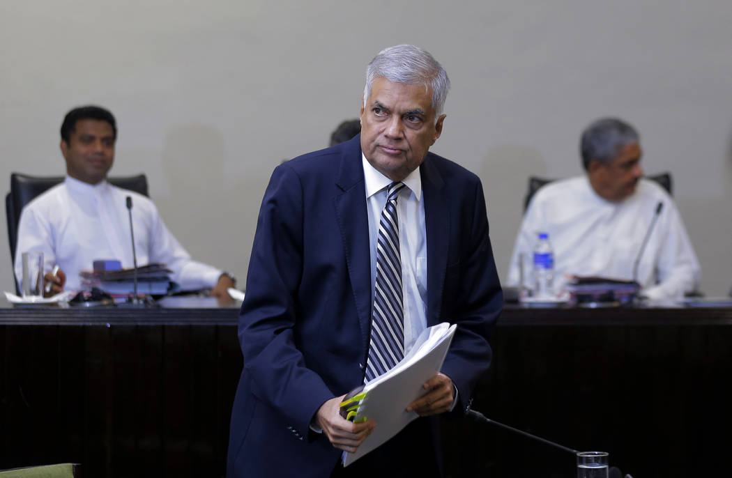Sri Lankan Prime Minister Ranil Wickremesinghe leaves after testifying in front of a parliament ...