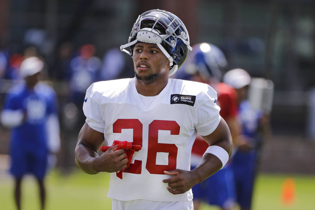 New York Giants running back Saquon Barkley (26) practices with teammates at the NFL football t ...