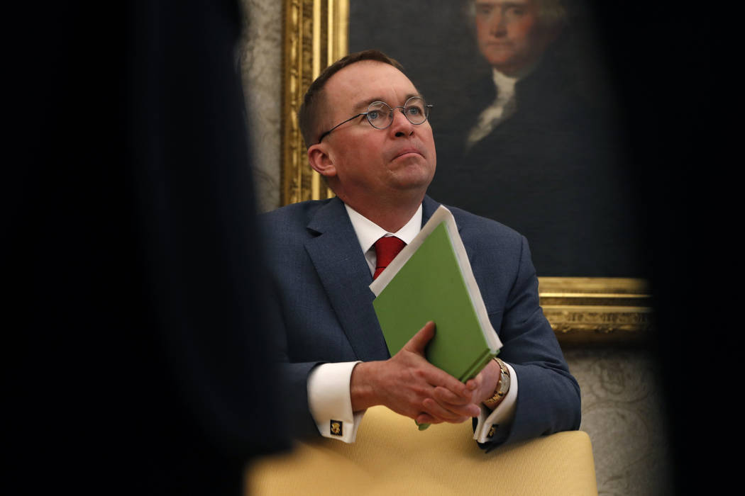 FILE - In this Jan. 31, 2019, file photo, acting White House chief of staff Mick Mulvaney liste ...