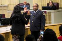 Henderson police chief Thedrick Andres stands during his ceremonial oath of office with Henders ...