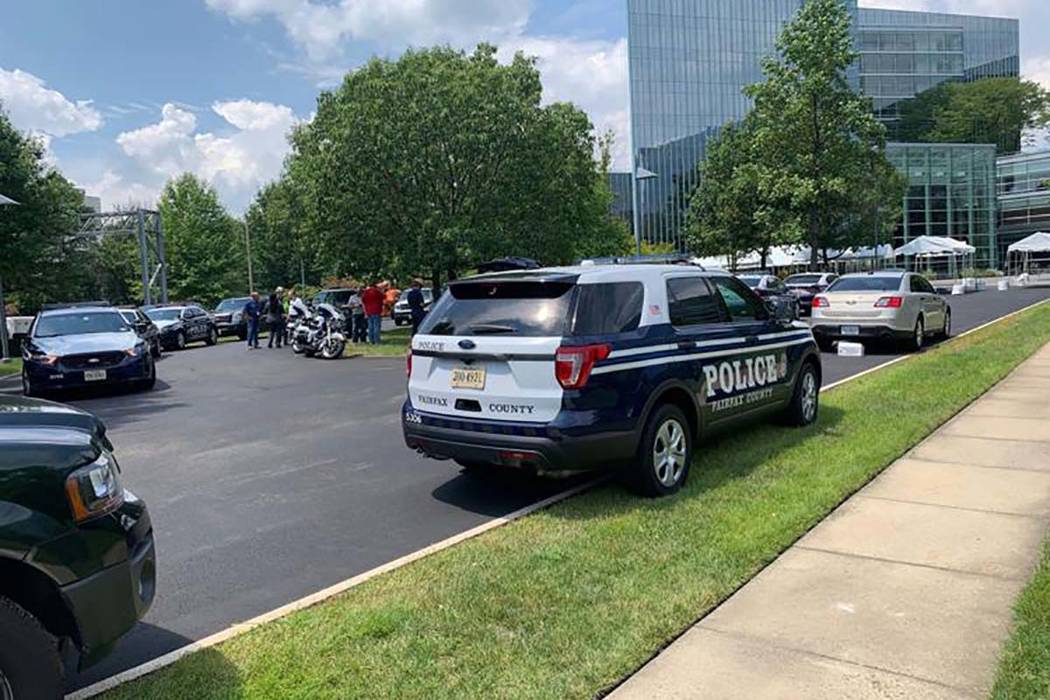 Police on the scene of the Gannett building in McLean after reports of a man with a gun on Wedn ...